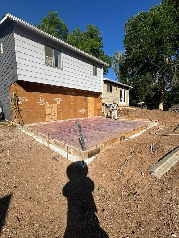 Home Addition Slab on Sydney Dr in Fort Collins, CO - before and after 1 — before