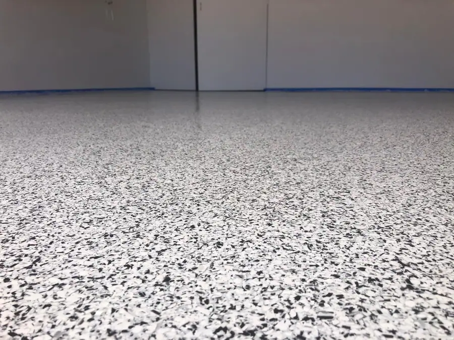 Gray, black and white flake epoxy garage floor