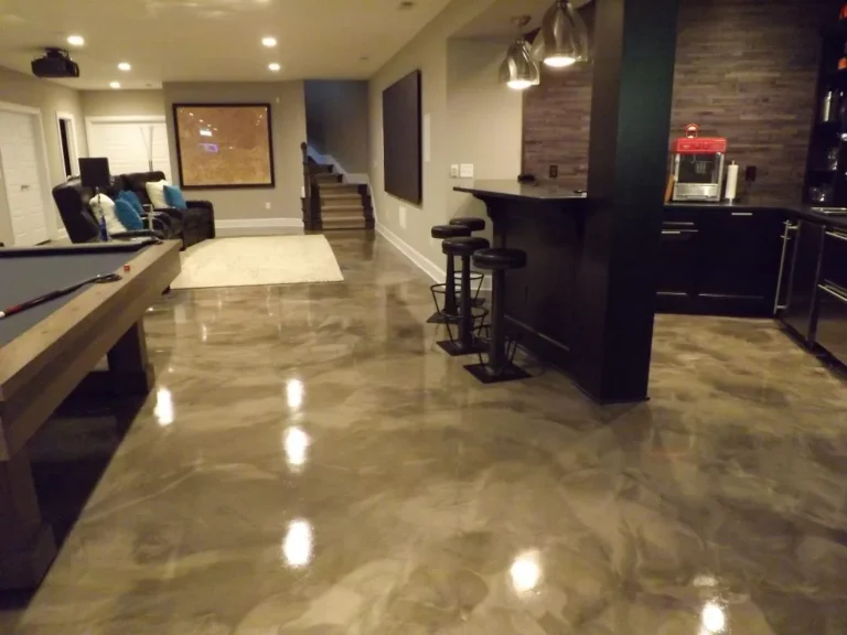 epoxy garage floors Stunning metallic epoxy basement floor installation in Fort Collins by Hugo's Concrete, featuring reflective bronze and copper tones with durable high-gloss finish