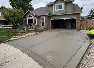 Concrete driveway and city sidewalk replacement completed for a residential property in Loveland, CO