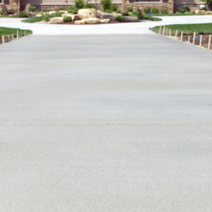 A freshly replaced, spacious, and beautifully finished concrete driveway in Loveland, CO, showcasing expert craftsmanship by Hugo’s Concrete.