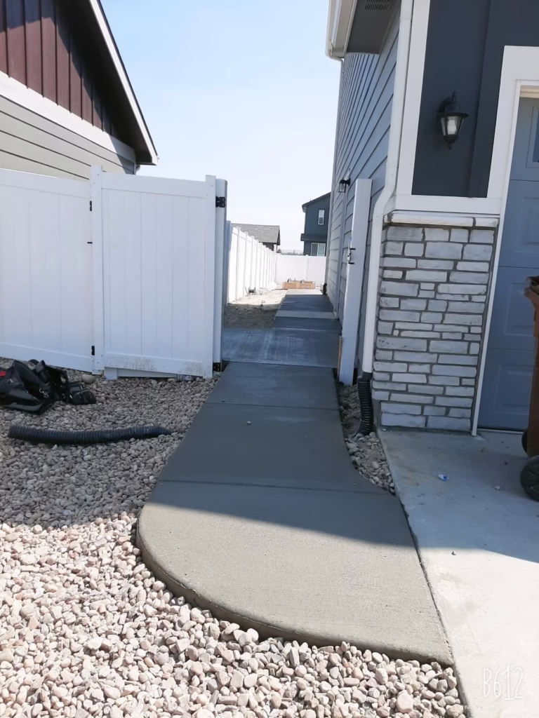 Freshly installed concrete sidewalk in Windsor, CO, with a smooth and clean finish